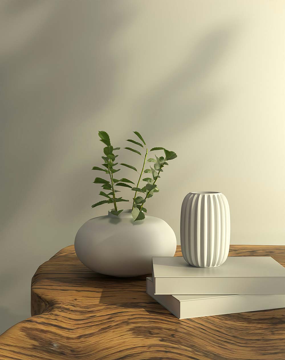 a white vase with a plant in it on a table