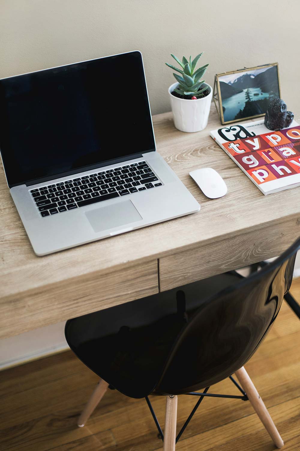 macbook pro on table with magic mouse