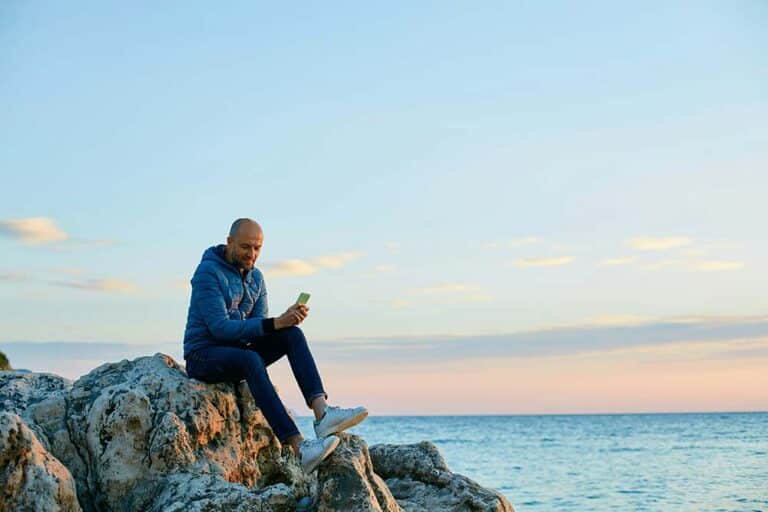 Young man standing on a beach